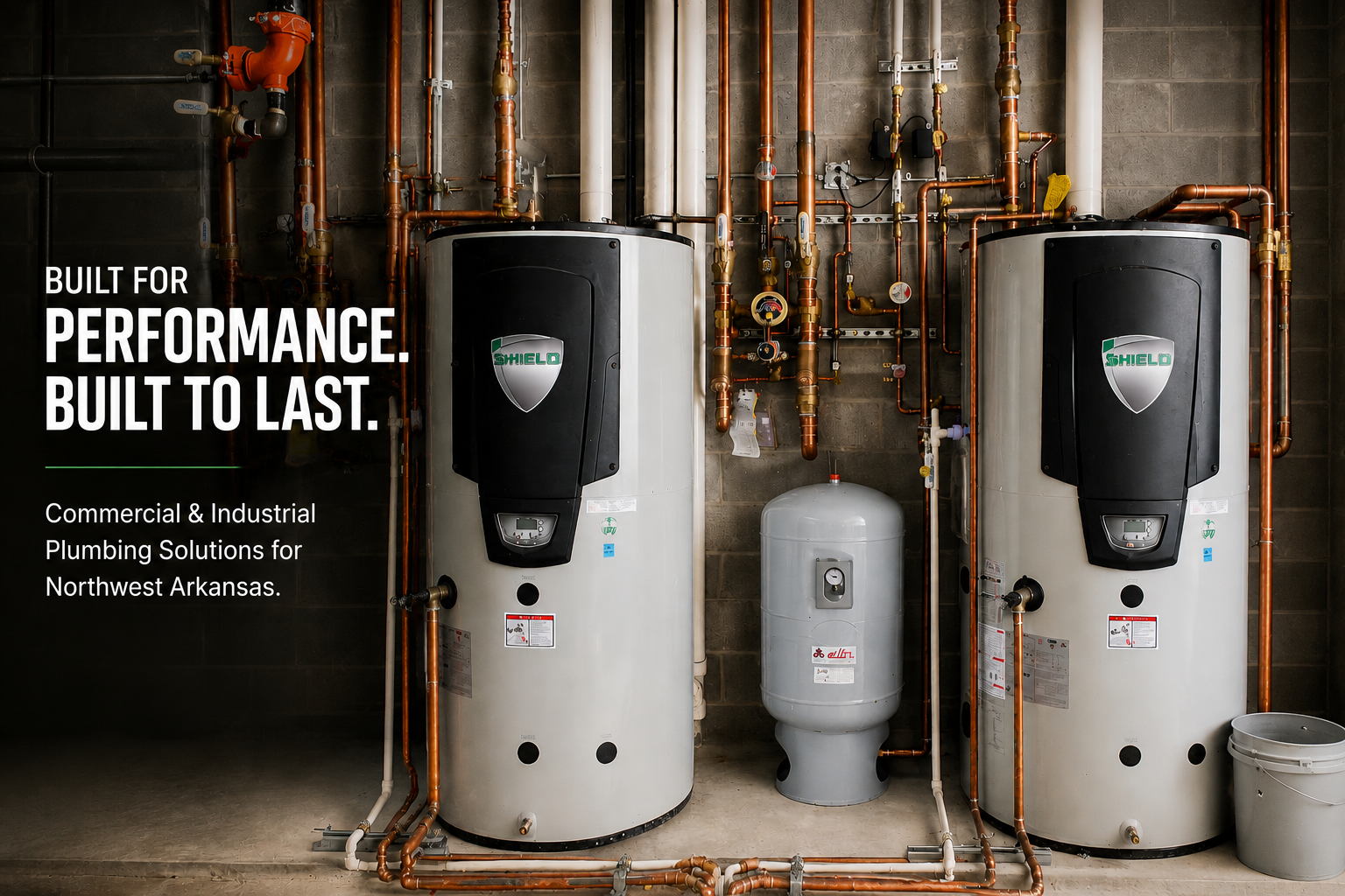 Commercial plumbing mechanical room with high-capacity water-heating equipment in Northwest Arkansas